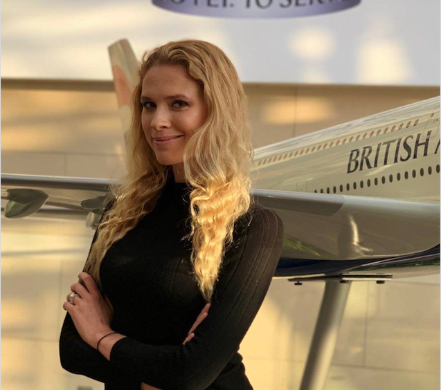 Irra Ariella Khi stood in front of a model of a British Airways plane