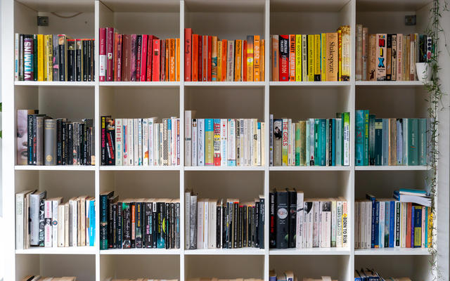 A photograph of a colourful bookshelf