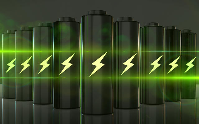 A row of batteries, with a lightning bolt symbol on each, and a bright green light illuminating the scene
