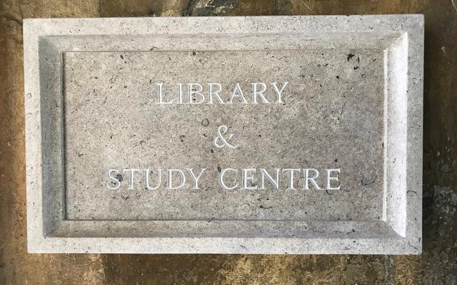 A stone plate saying 'Library & Study Centre'