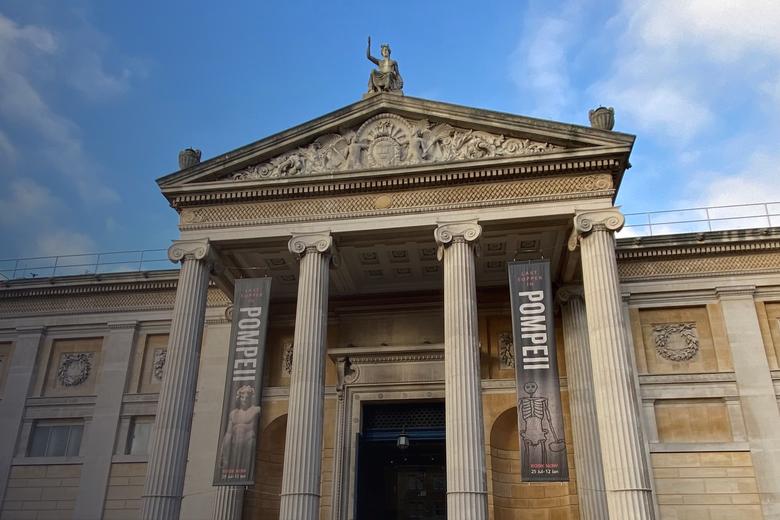 The exterior of the Ashmolean Museum, looking up from ground level on Beaumont Street