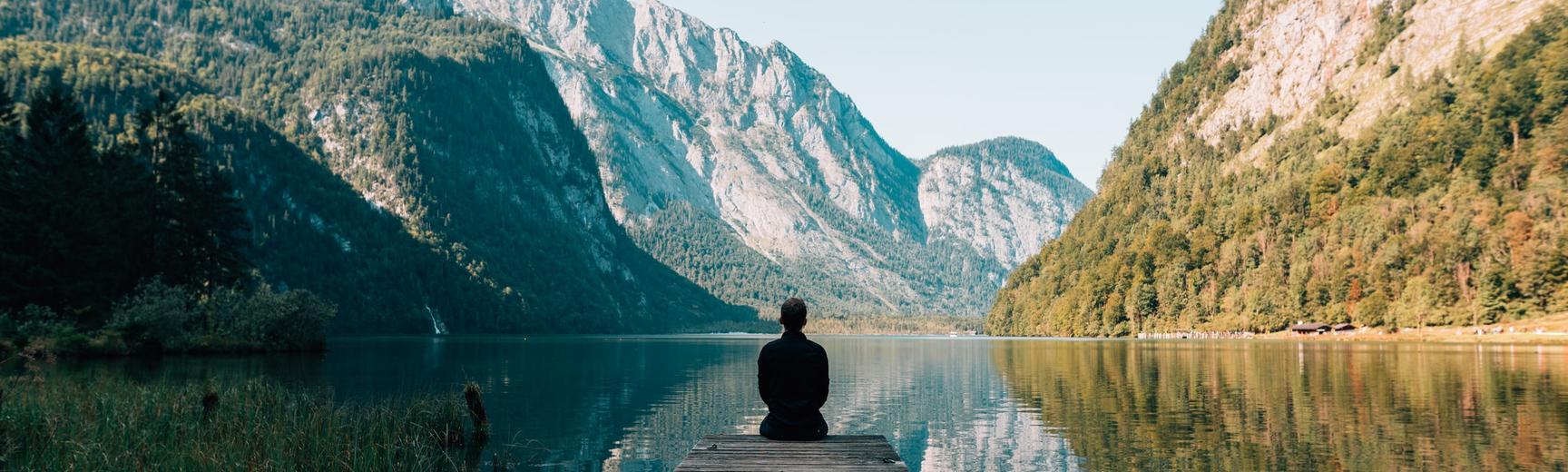 Mindfulness of man sitting by a lake