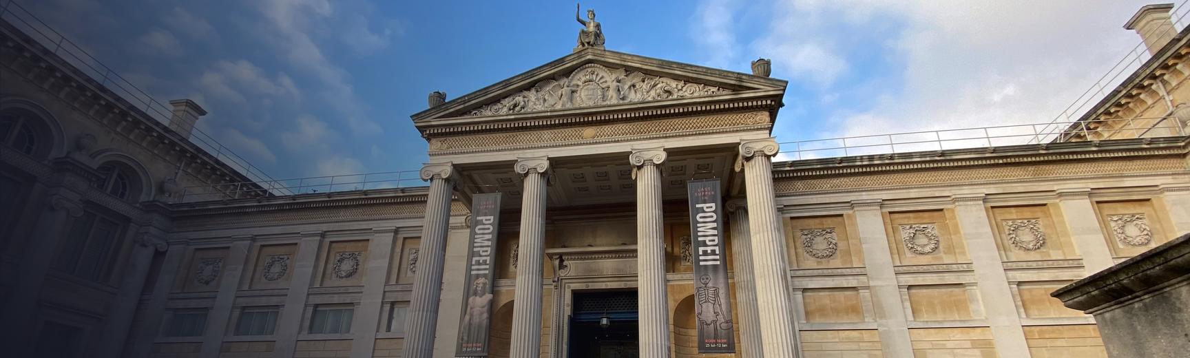 The exterior of the Ashmolean Museum, looking up from ground level on Beaumont Street