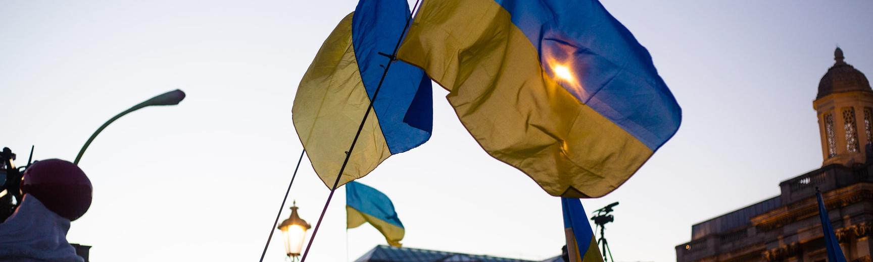 Ukraine flags waving CREDIT Karollyne Hubert via Unsplash