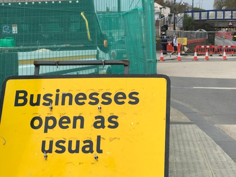 'Businesses open as usual' sign