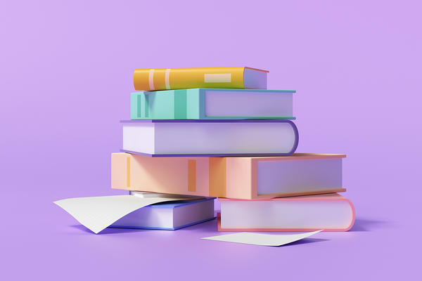 Stack of books on a purple background