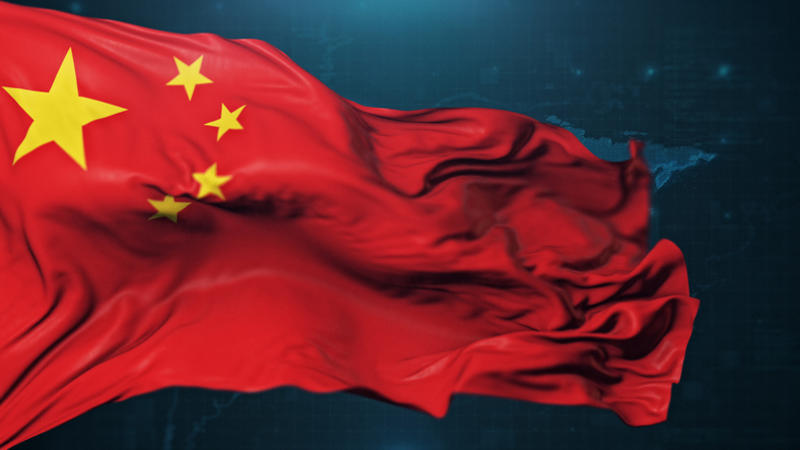 Chinese flag against a dark background