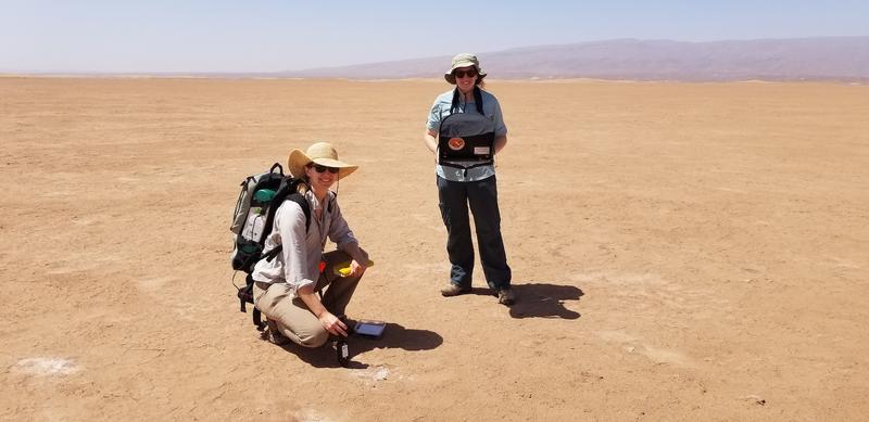 Bethany Elhmann and a colleague in the middle of a desert