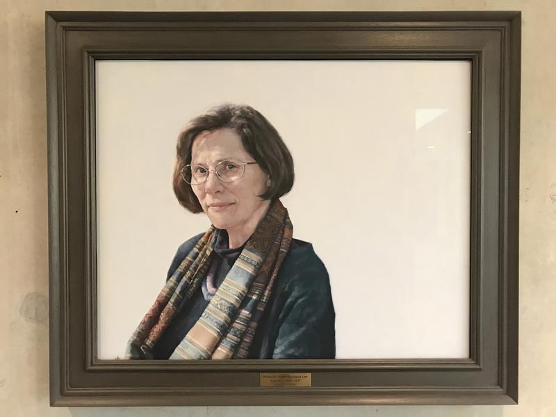 A portrait of Professor Dame Hermione Lee in a brown frame