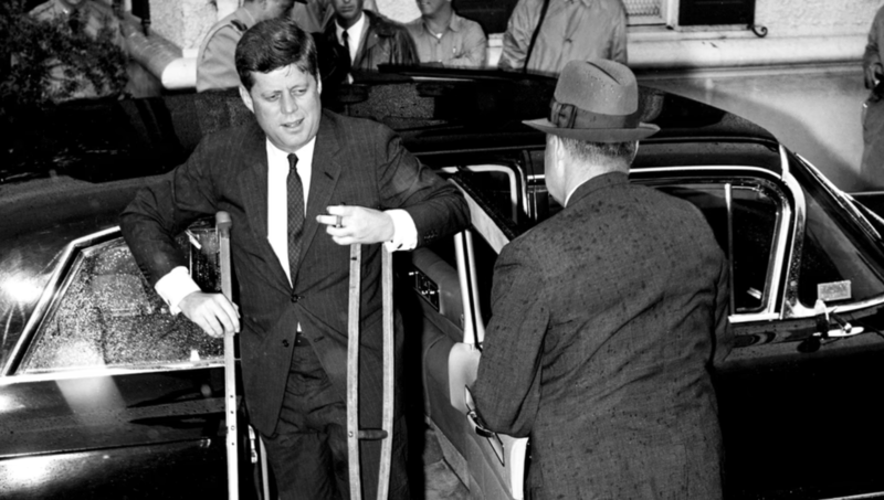 John F Kennedy using crutches