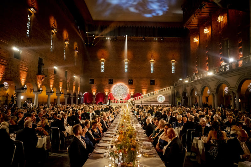 The 2019 Nobel Banquet - a large banquet in a grand hall, with a stage visible at the end of the room