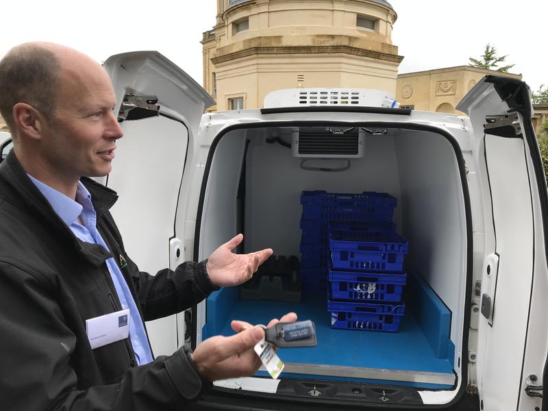 Matthew Alden showing the inside of his refrigerated, electric van